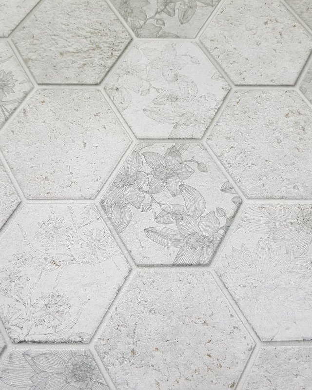 Elegant stone tile with a subtle floral pattern.