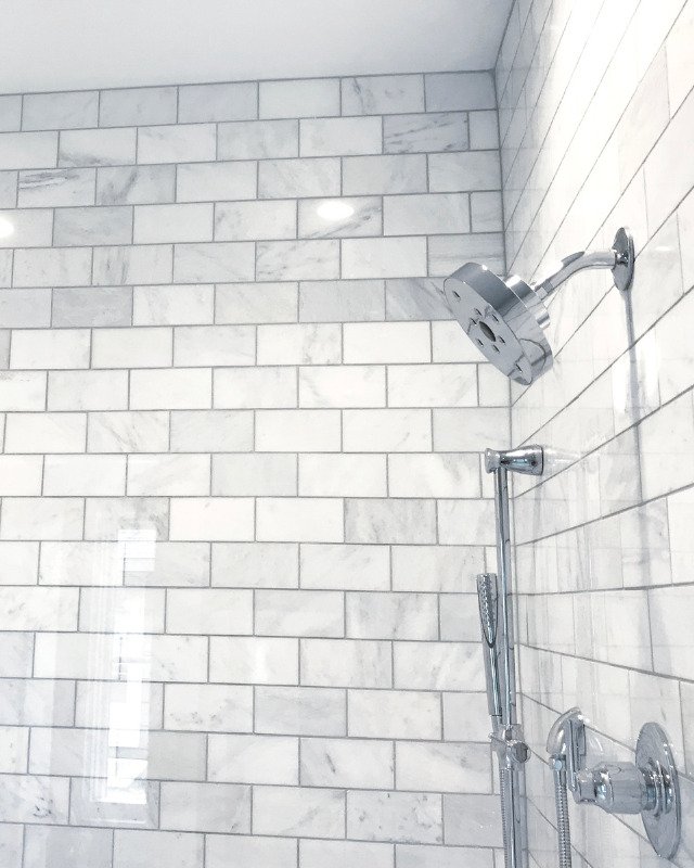 Custom shower renovation in Jersey City, NJ featuring gray and white subway shower tile.