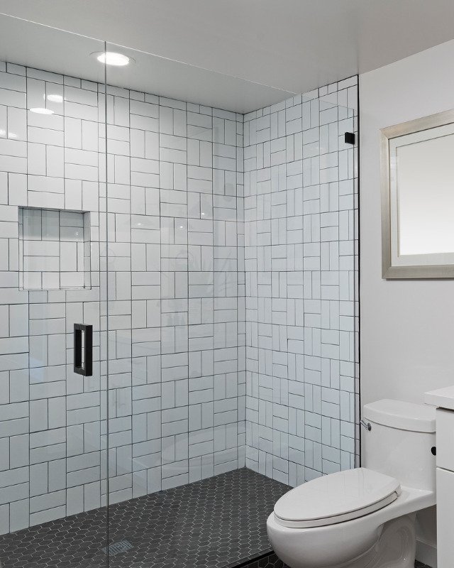 Bathroom remodel in Hoboken, NJ featuring a large glass-enclosed walk-in shower.