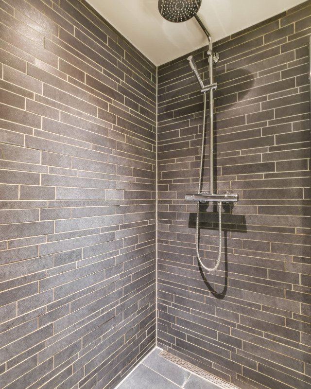 Secaucus, NJ bath remodel with classic gray shower tile.