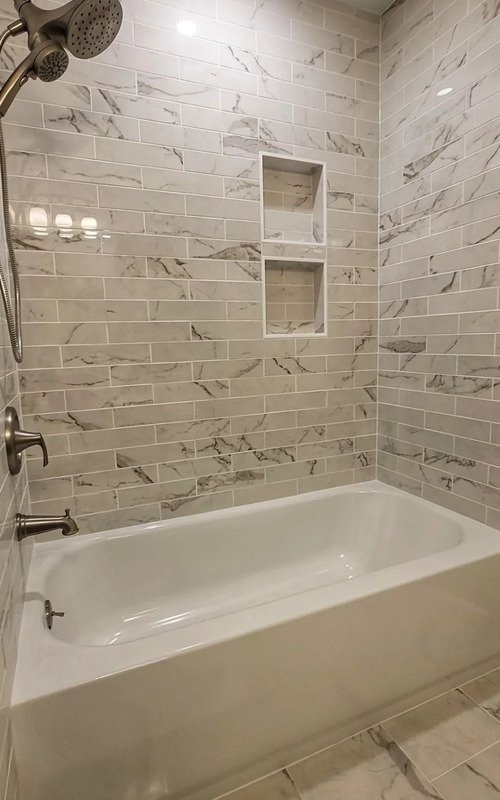 Renovated shower with marble subway tiles in Hoboken, NJ